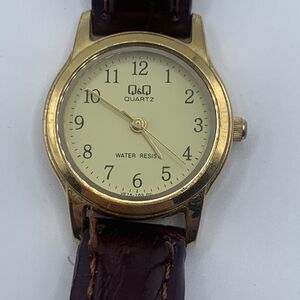 Q&Q Quartz Gold Tone Dark Brown Faux Leather Band Gold Face Women's Watch A13